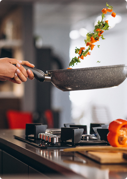 Cooking vegetables in a pan with colorful ingredients