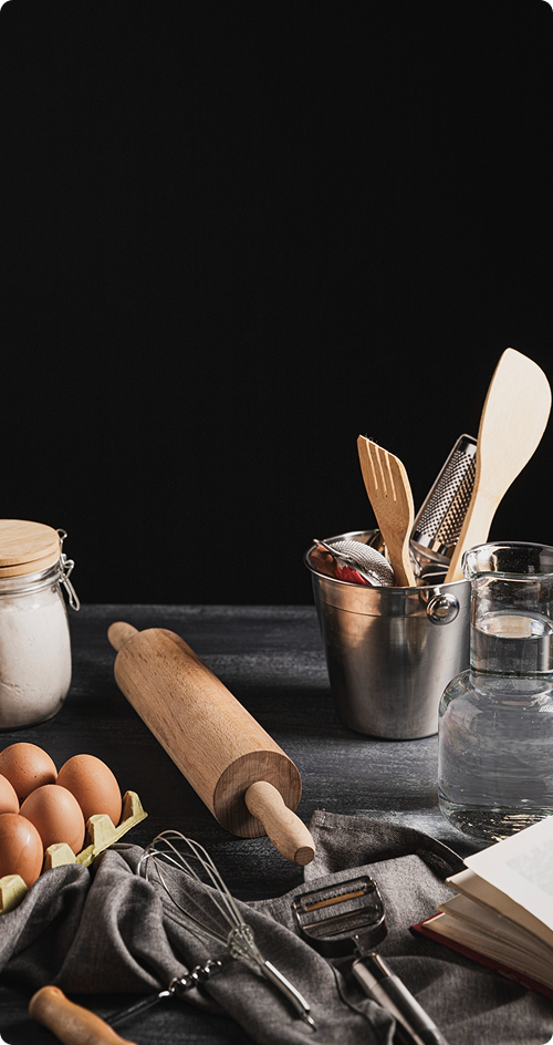 Professional kitchen with various pans and cooking equipment