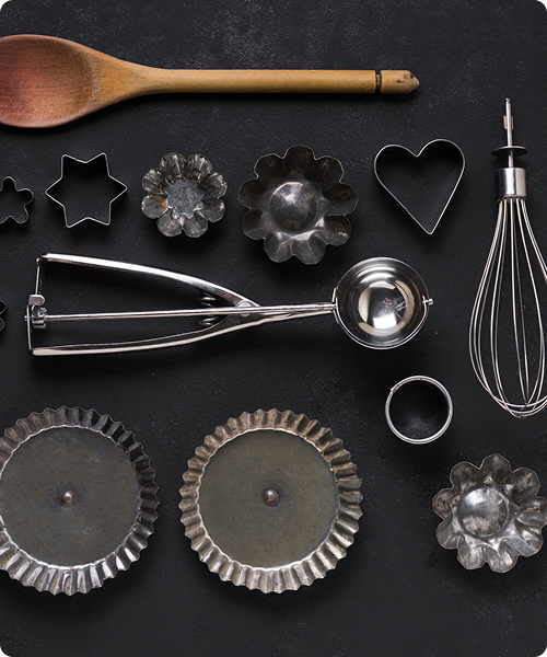 Essential kitchen tools and utensils laid out