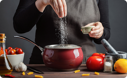 Cooking process with red pot and vegetables